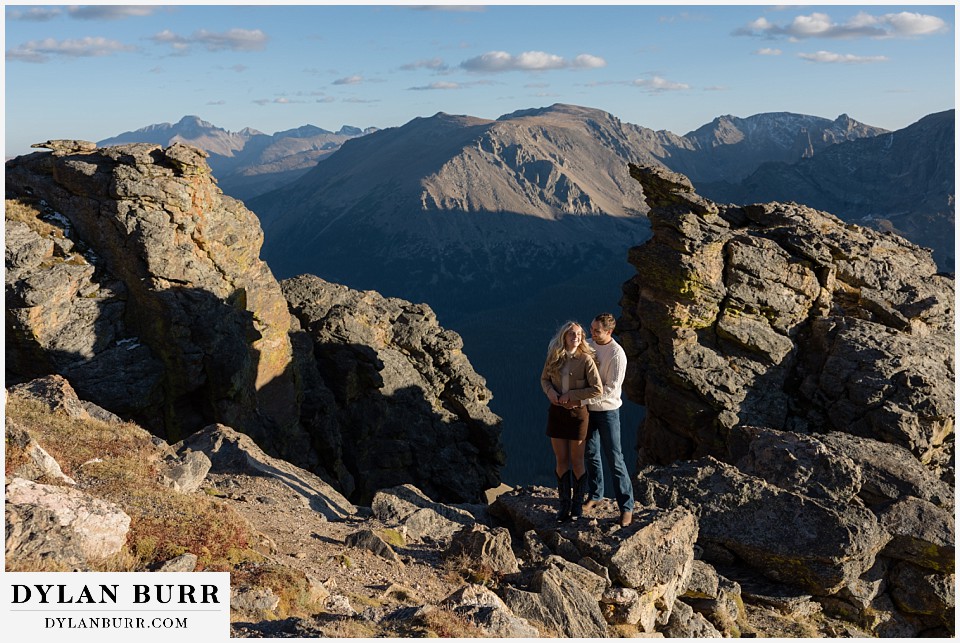 trail ridge road marriage proposal standing together in rock cut