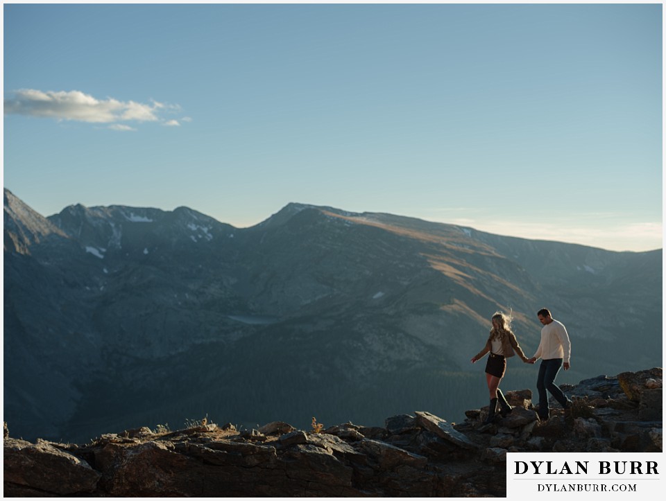 trail ridge road marriage proposal walking together on mountain ridge