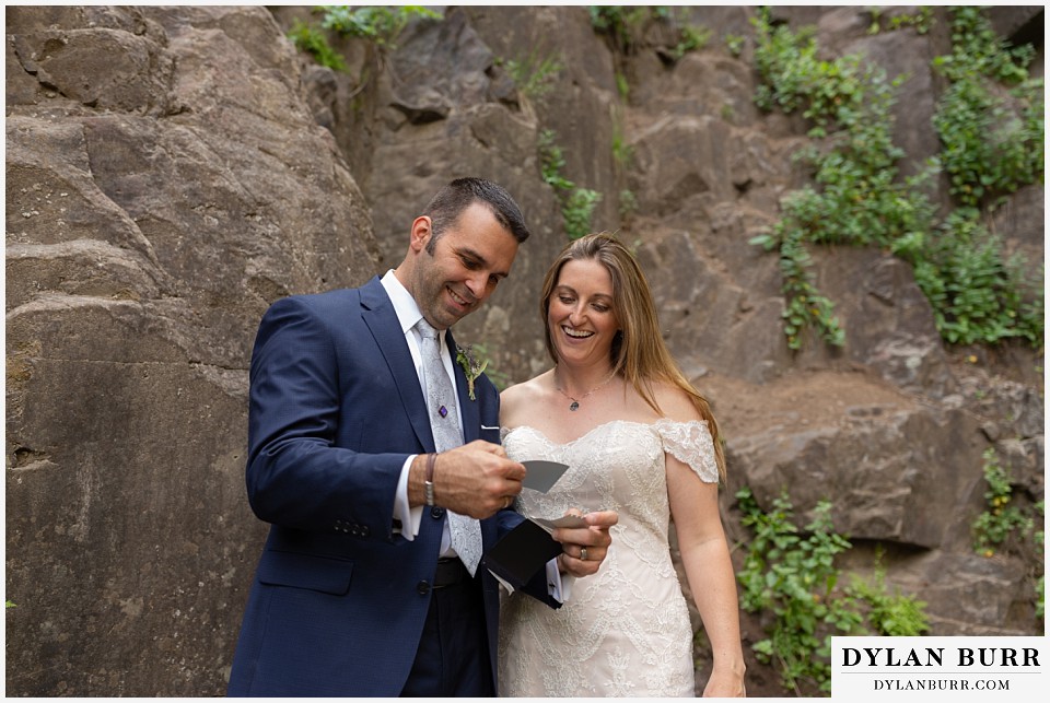 uncompahgre national forest colorado elopement wedding adventure bride and groom looking at polaroid photograph