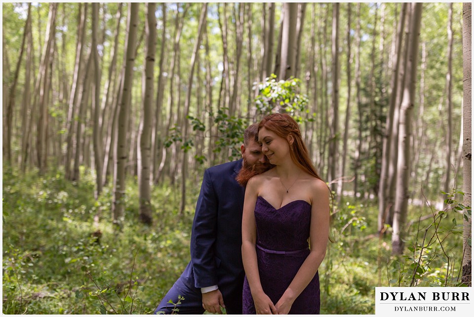 uncompahgre national forest colorado elopement wedding adventure maid of honor and best man taking a moment in aspen trees