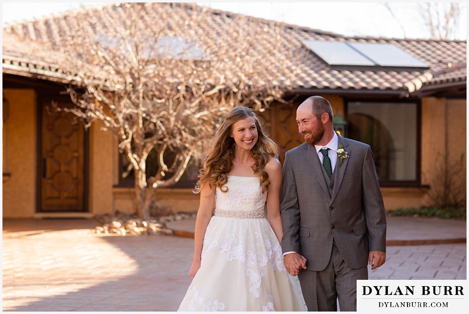 villa parker wedding parker colorado bride and groom walking hand and hand