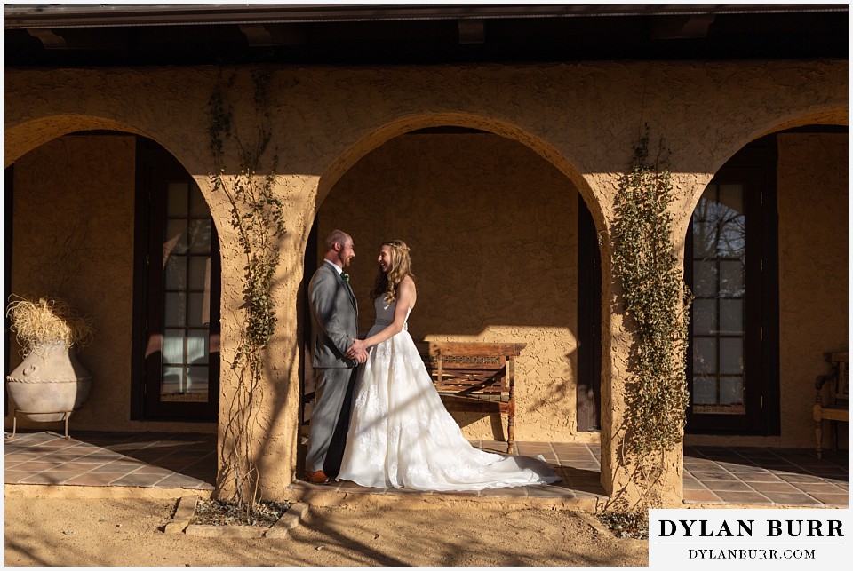 villa parker wedding parker colorado bride and groom standing in archway