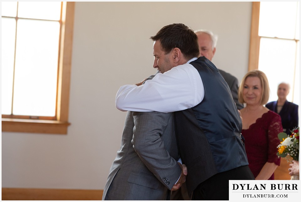 villa parker wedding parker colorado groom hugging brides father