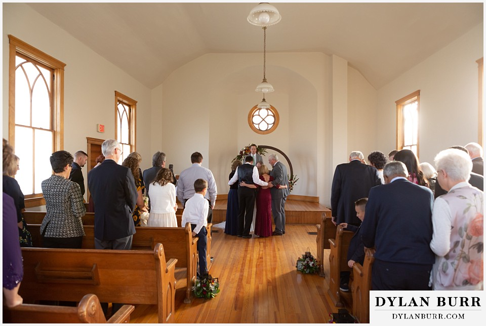 villa parker wedding parker colorado entire family praying together