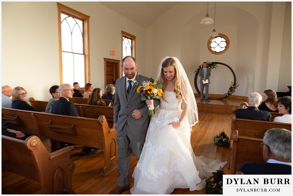 villa parker wedding parker colorado bride and groom walking out