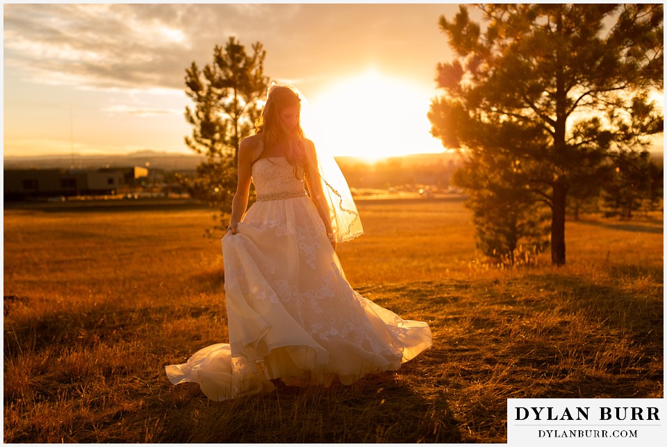 villa parker wedding parker colorado bride standing alone in sunset glow