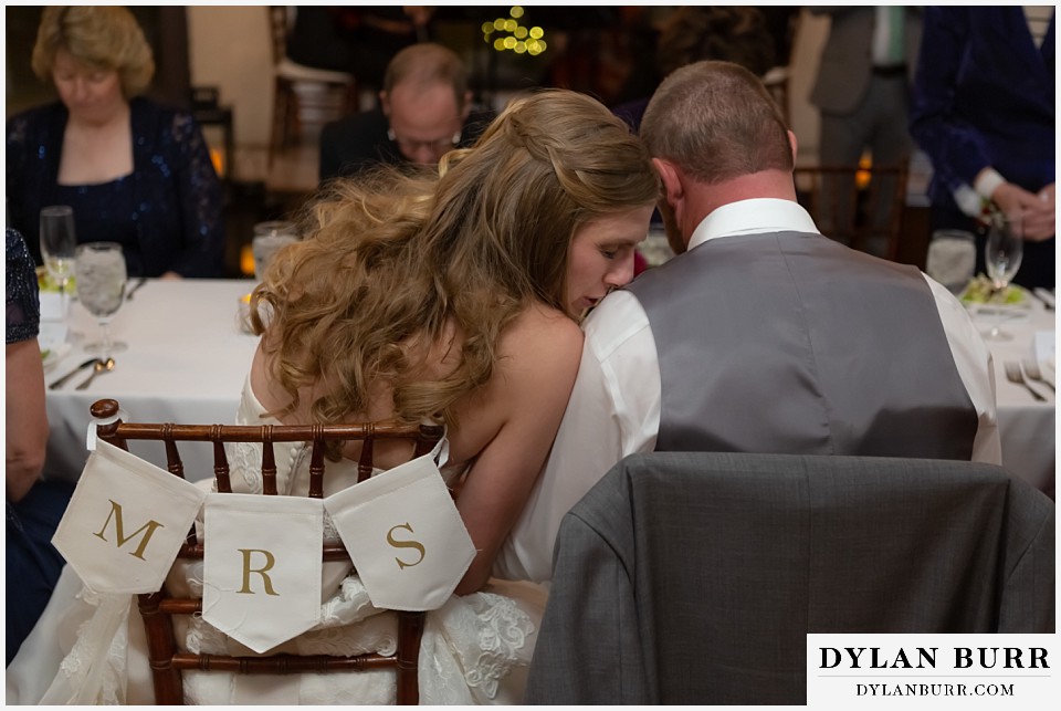 villa parker wedding parker colorado bride kissing grooms shoulder