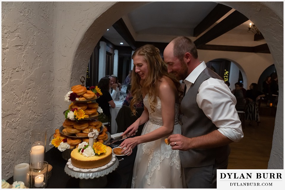 villa parker wedding parker colorado bride and groom cutting cake