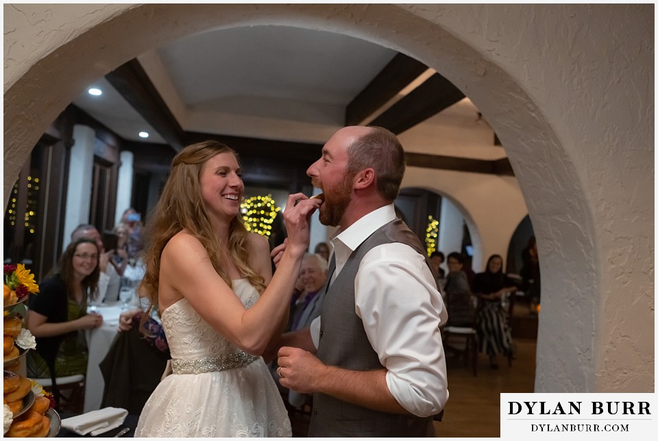 villa parker wedding parker colorado feeding each other doughnuts