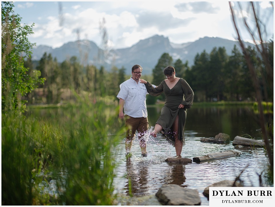 water engagement session rocky mountain national park spashing in sprague lake