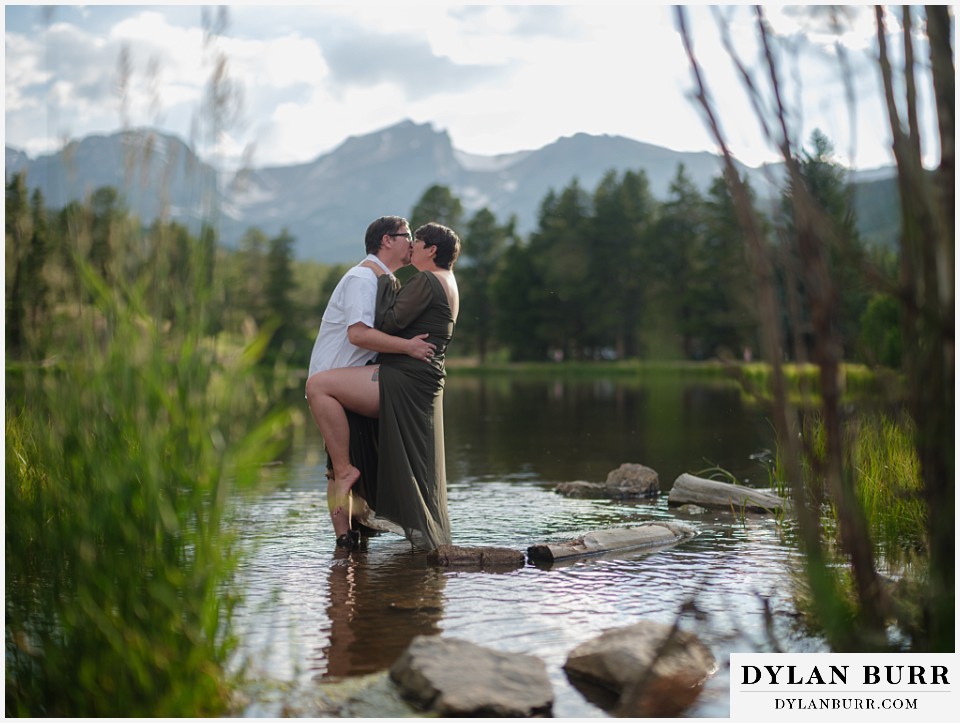 water engagement session rocky mountain national park kissing in sprague lake