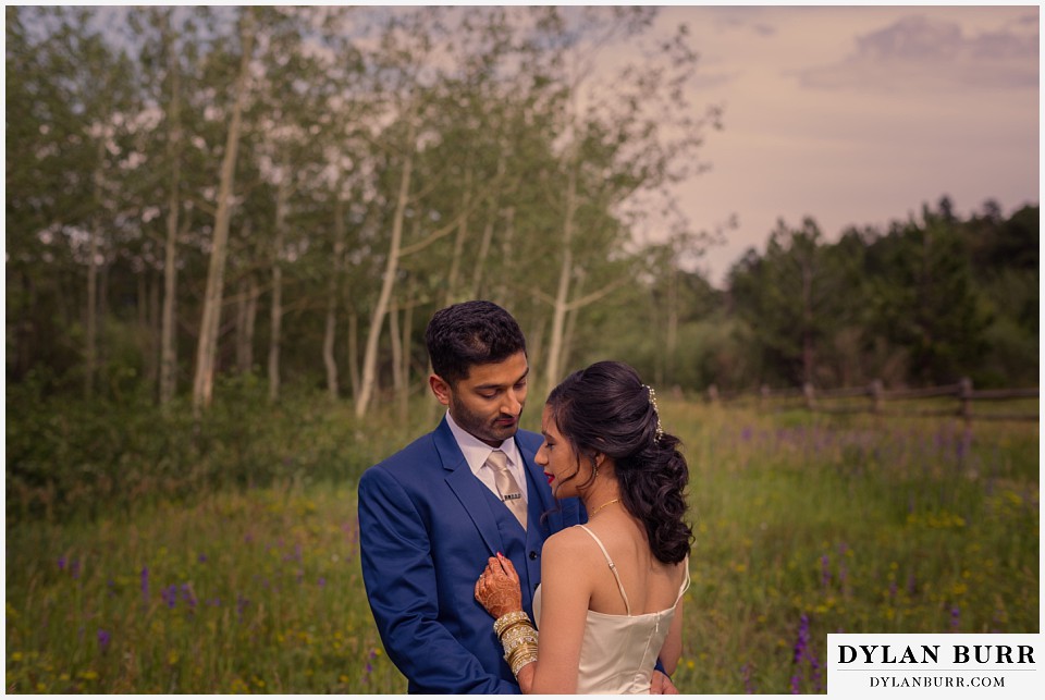 wild basin lodge hindu wedding couple wildflowers meadow