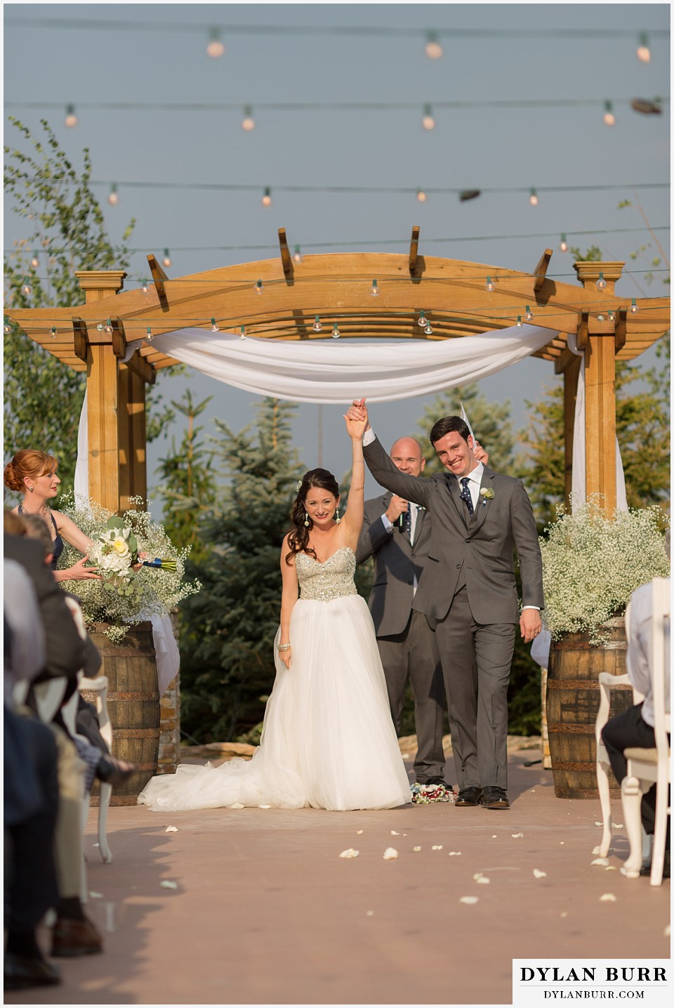 willow ridge manor wedding bride and groom cheering while exiting ceremony