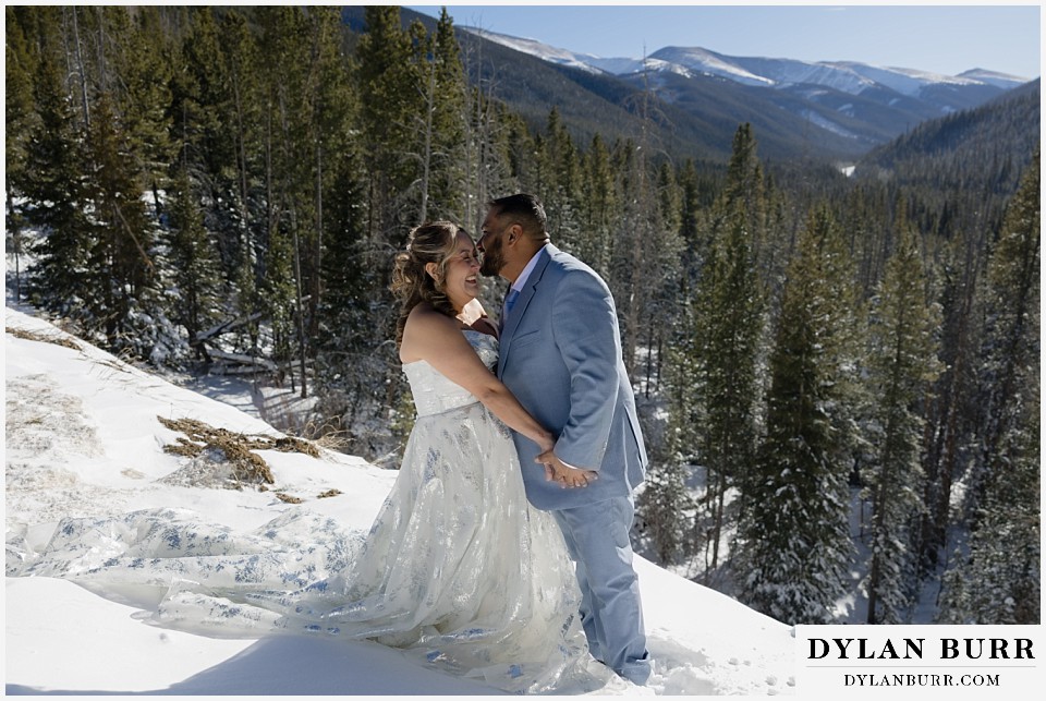 winter elopement wedding near winter park colorado together on the cliffside