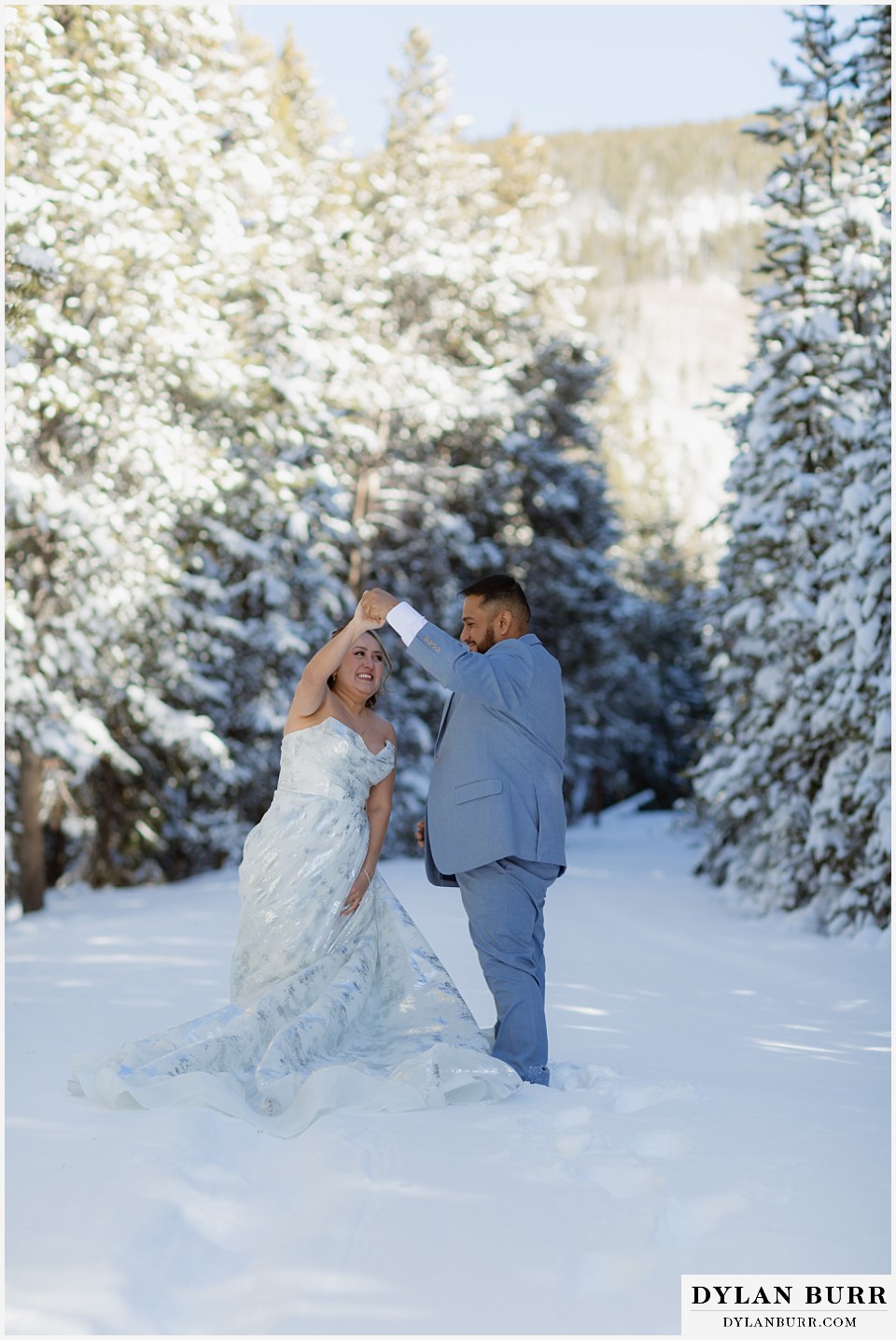 winter elopement wedding near winter park colorado dancing in the snow