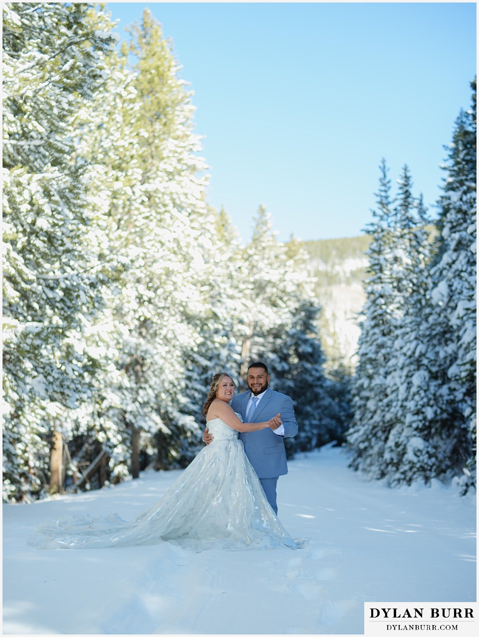 winter elopement wedding near winter park colorado in the snow covered pine trees