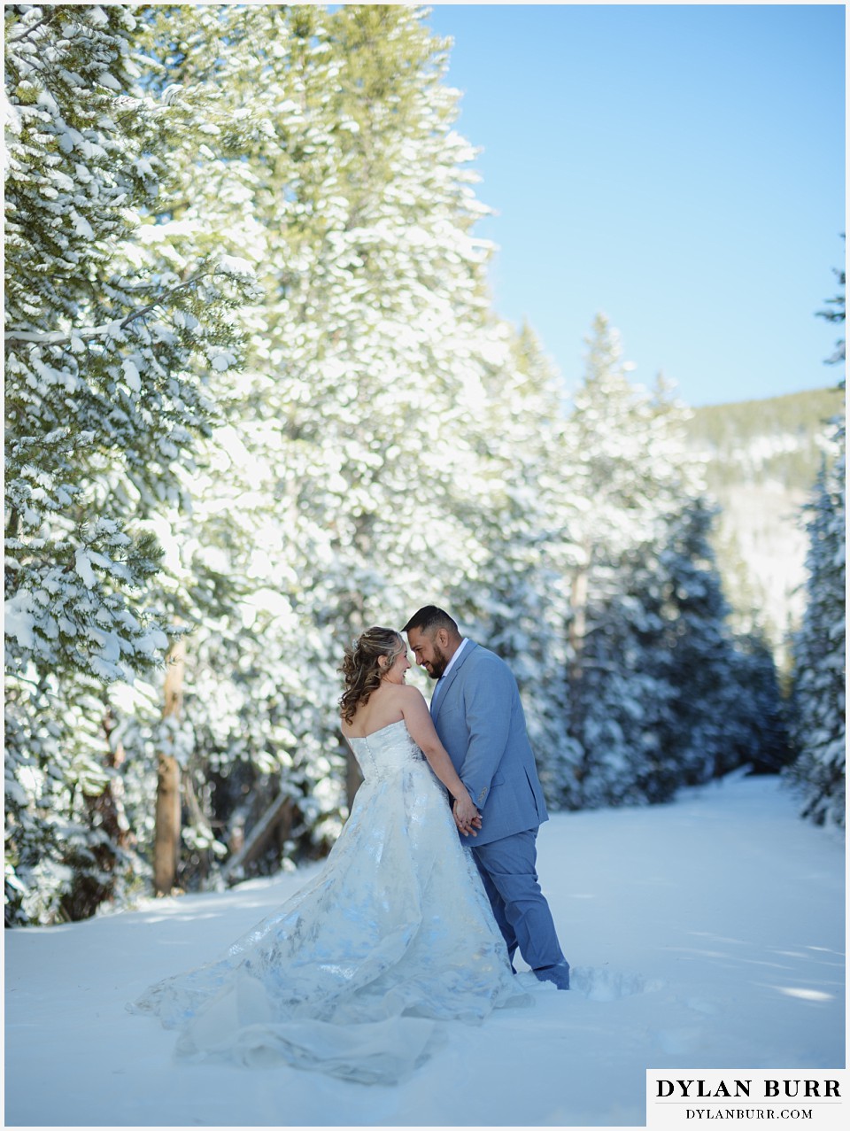 winter elopement wedding near winter park colorado couple getting in close