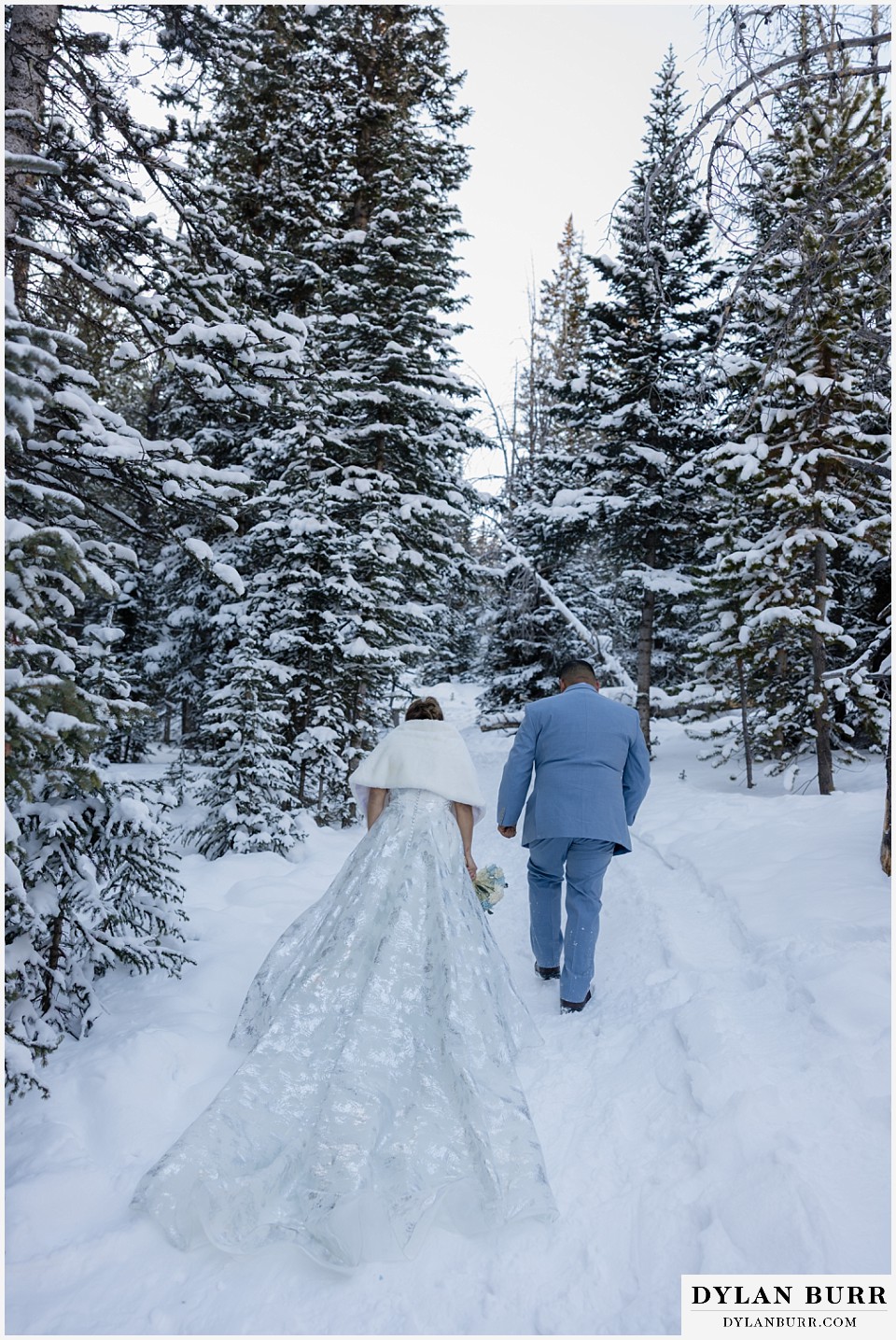 winter elopement wedding near winter park colorado long shimmery dress in snow