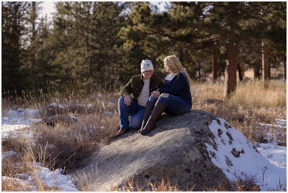 engagement photos couple together on rock