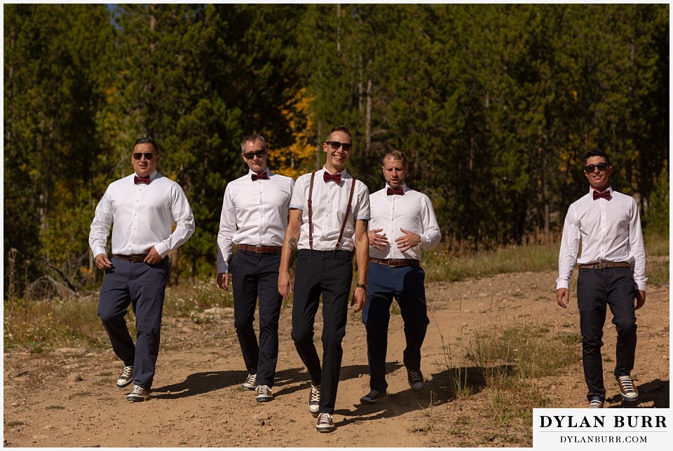 winter park mountain lodge wedding colorado groomsmen walking down mountain