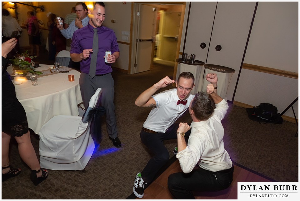 winter park mountain lodge wedding colorado groom and friend dancing goofy