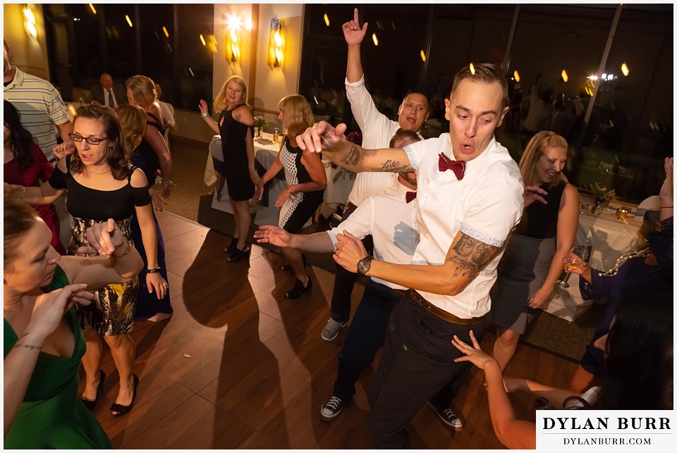 winter park mountain lodge wedding colorado reception party groom jumping