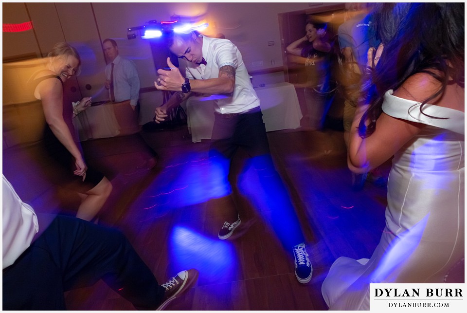 winter park mountain lodge wedding colorado reception groom rocking out on air guitar