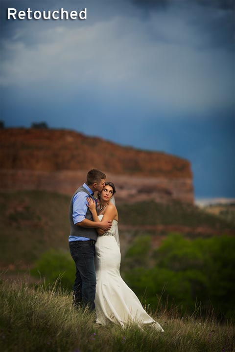 bride and groom together with red rock bluff mountains