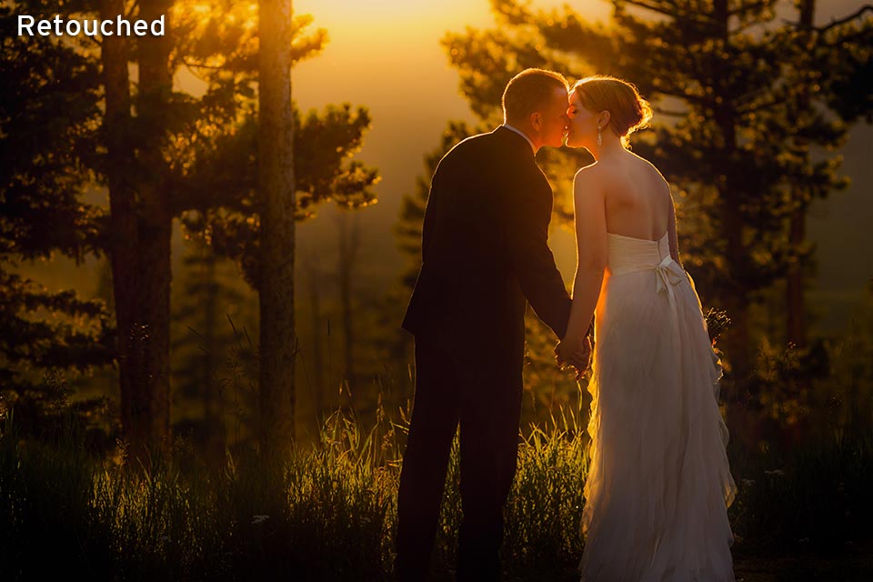 wedding couple standing together in mountains at sunset