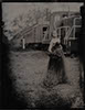 wedding tintype wet plate of bride in a black dress in a railyard outside boulder full of trains